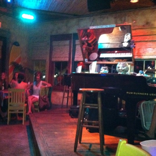 Photo taken at Rum Runners Dueling Piano Bar by Kati R. on 6/21/2011