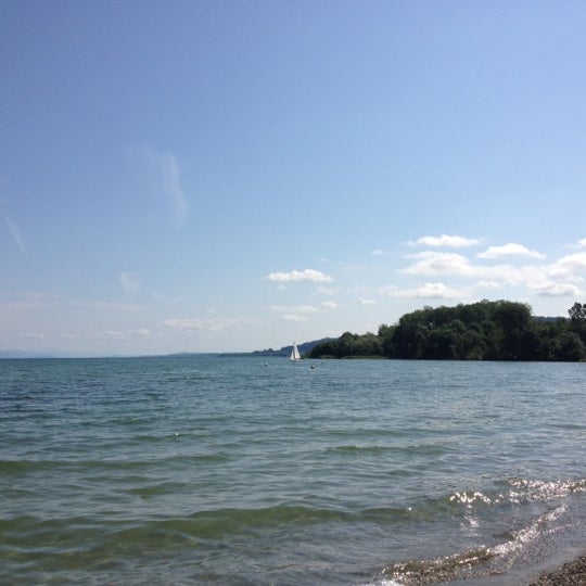 Photo taken at Yvonand Plage by Sarah on 6/17/2012