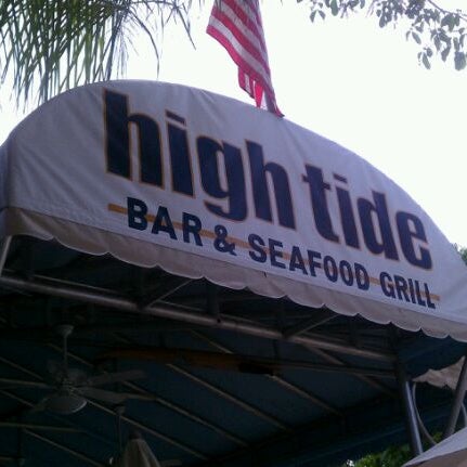 Photo taken at High Tide Bar &amp; Seafood Grill by Rob K. on 4/17/2012