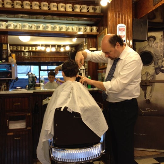 Photo taken at Paul Mole Barber Shop by Will P. on 3/17/2012