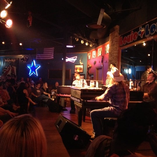 Photo taken at Louie Louie&#39;s Dueling Piano Bar by Brian L. on 4/15/2012