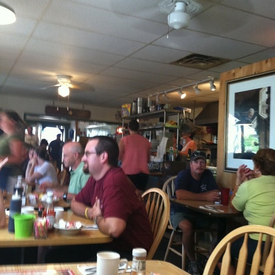 Photo taken at Brass Compass Cafe by Carol B. on 7/24/2011
