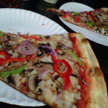 Photo taken at Slices Pizza by Cody J. on 4/21/2012