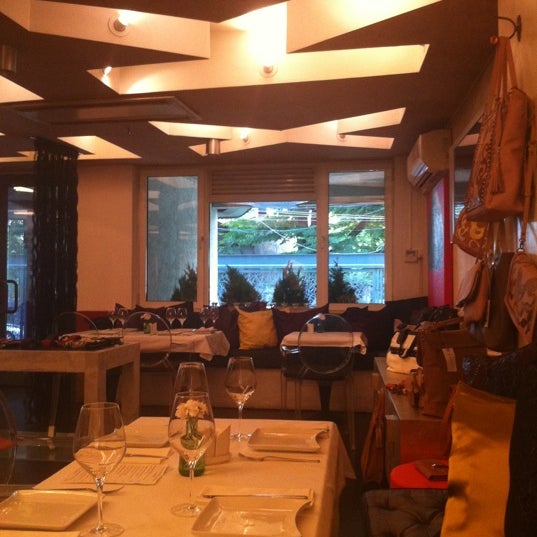Photo taken at DADA Restaurant by oana m. on 8/11/2011