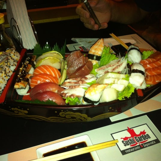 Photo taken at Sushi Garden by Charles W. on 3/4/2012