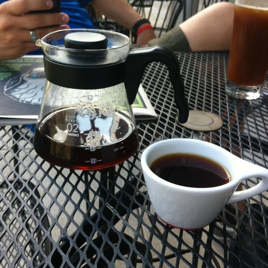 Photo taken at Comet Coffee by AJ E. on 8/21/2012