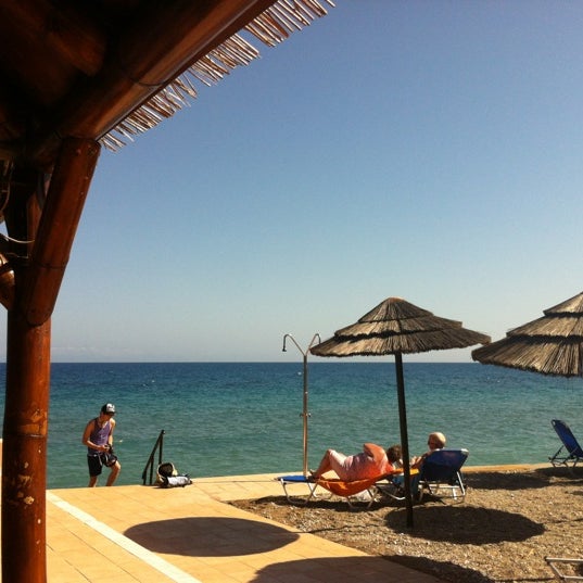Photo taken at Avra Beach Resort Hotel &amp; Bungalows by Erik S. on 4/28/2012