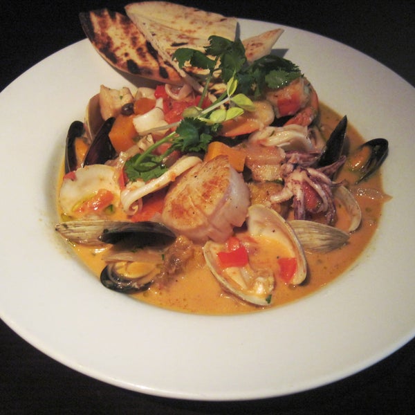 Tonight's Special:  Bahamian Seafood Stew with shrimp, fish, clams, mussels, calamari & scallops, pigeon peas, sweet potatoes & spinach in a spicy coconut-lime broth!