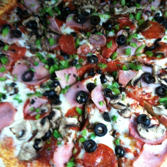 Photo taken at Deli News Pizza by Brittany W. on 4/25/2012