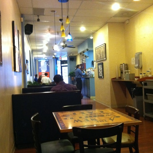 Photo taken at New World Coffee House by Ann P. on 3/16/2011