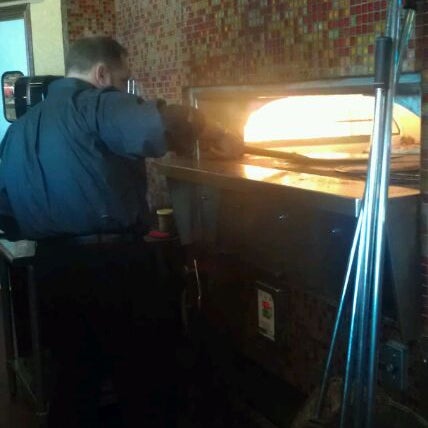 Photo taken at Russo&#39;s Coal-Fired Italian Kitchen by Jeanie W. on 12/21/2011