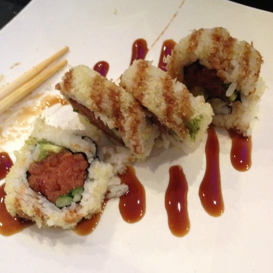 Photo taken at Chomp Sushi &amp; Teppan Grill by Laura R. on 7/4/2012