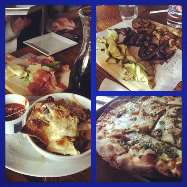 Photo taken at Ducali Pizzeria &amp; Bar by Gloria C. on 5/11/2012