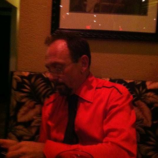 Photo taken at Tropics Piano Bar &amp; Restaurant by Steven on 9/5/2012