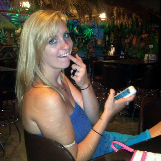 Photo taken at Gilligan&#39;s Tropical Bar &amp; Grill by Victoria M. on 8/4/2012