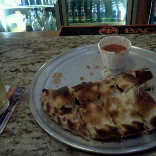 Photo taken at Sam&#39;s Pizza by Kevin D. on 1/27/2012