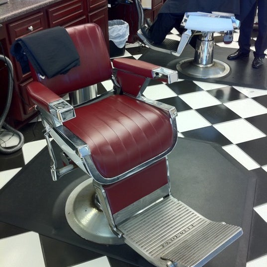 Photo taken at Gino&#39;s Classic Barber Shoppe by Cooper G. on 7/19/2011