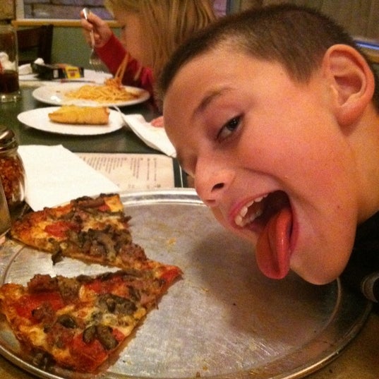 Photo taken at Fricano&#39;s Pizza Restaurant by Mike K. on 10/21/2011