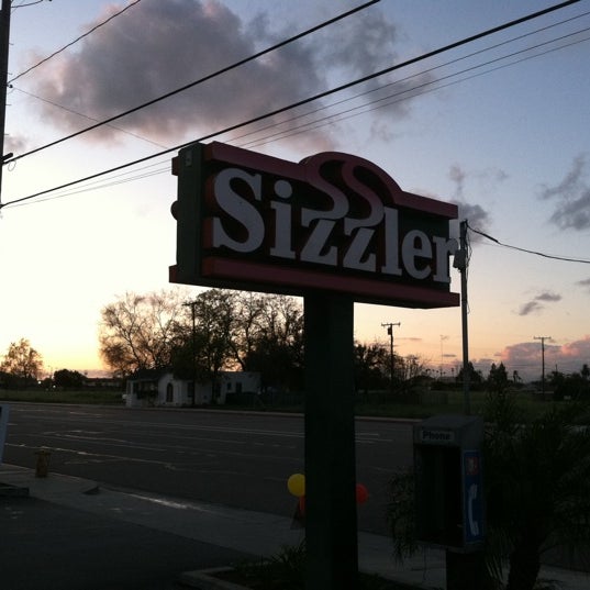 Photo taken at Sizzler by Sarah P. on 3/22/2011