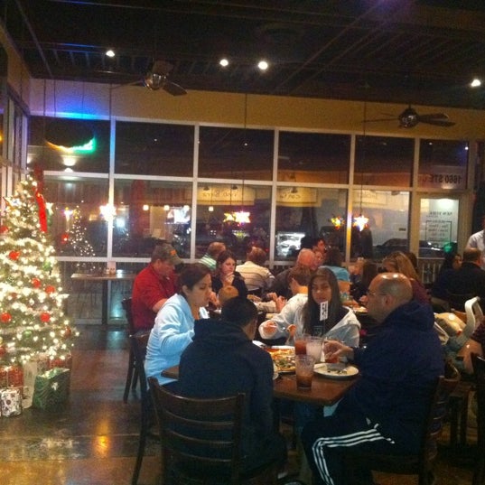Photo taken at Russo&#39;s New York Pizzeria by Chris G. on 12/18/2011