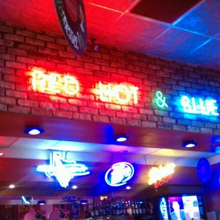 Photo taken at Red Hot &amp; Blue  -  Barbecue, Burgers &amp; Blues by Dre D. on 3/1/2012