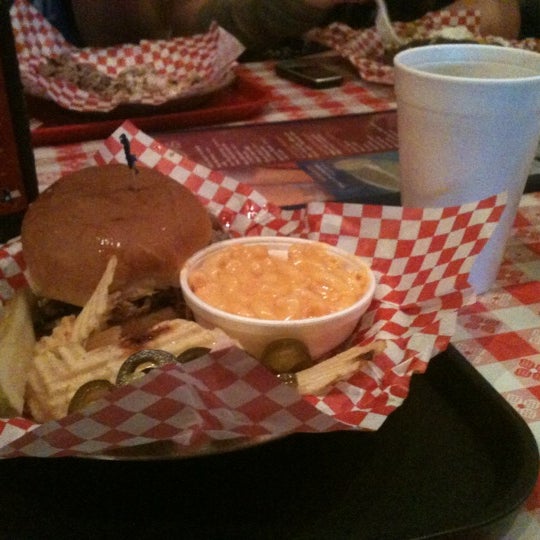 Photo taken at Dick&#39;s Bodacious BBQ by Tyler R. on 8/18/2012