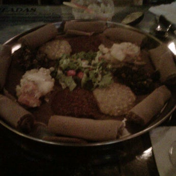 Photo taken at Queen of Sheba Ethiopian Restaurant by Daina P. on 4/6/2012