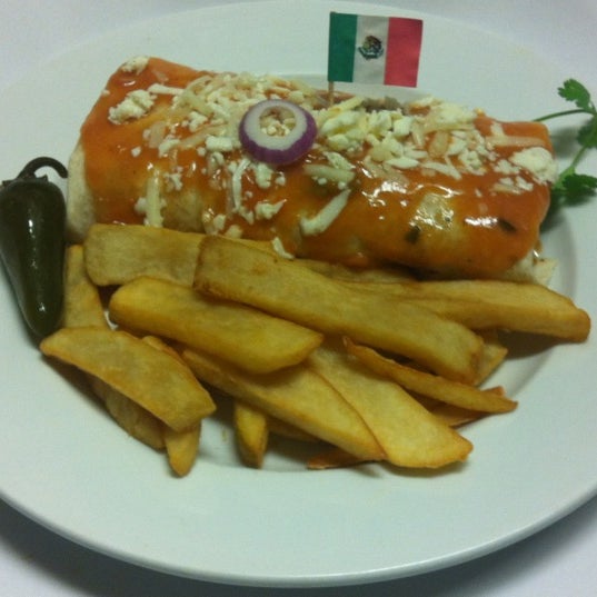 Снимок сделан в Ensenada Restaurant and Bar пользователем Marisol R. 12/14/2011