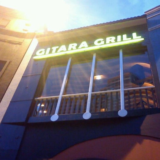Photo taken at Gitara Grill by Krisanne B. on 12/12/2011