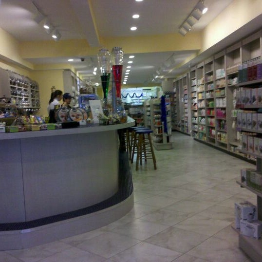 Photo taken at Tisane Pharmacy &amp; Cafe by Becki W. on 12/23/2011