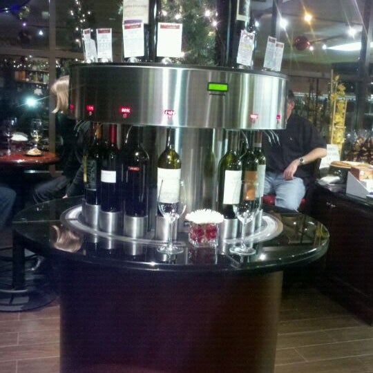Photo taken at OC Wine Mart &amp; Tasting Bar by Melissa B. on 1/6/2012