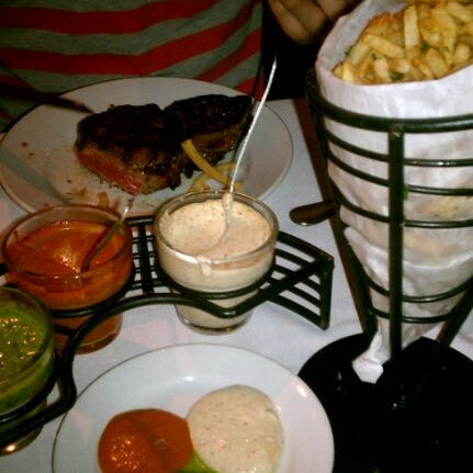Photo taken at La Boca Steaks by Lilly V. on 3/25/2012