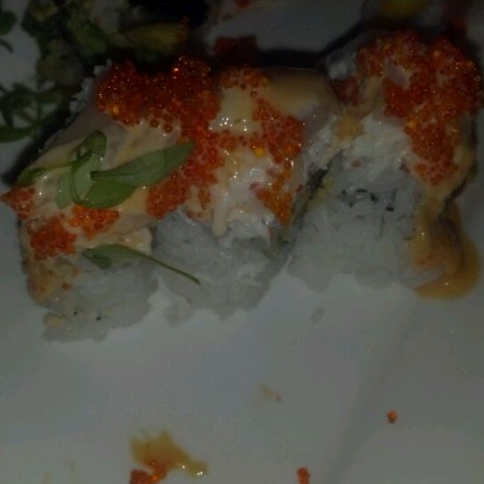Photo taken at Okura Robata Sushi Bar and Grill by Lydia A. on 6/2/2012