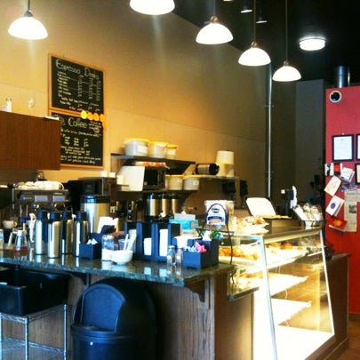 Photo taken at Mystic Coffee Roaster by Penny C. on 12/29/2010