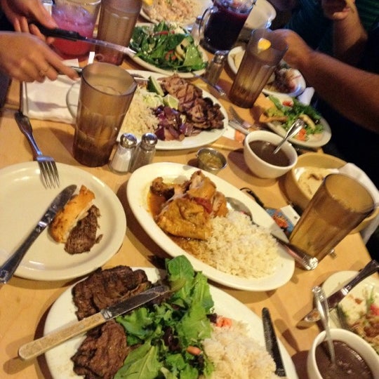 Photo taken at Poc-Chuc Restaurant by Lauren N. on 8/16/2012