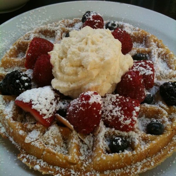 Waffle w berries, whipped cream and toasted almonds...