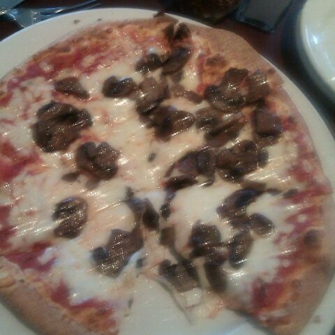 Photo taken at Graziano&#39;s Brick Oven Pizza by Harriet B. on 2/24/2012