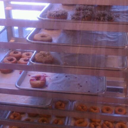 Photo taken at Peace Love &amp; Little Donuts by Brandi J. on 3/29/2012