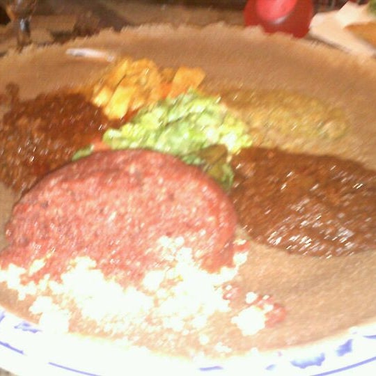 Photo taken at Queen of Sheba Ethiopian Restaurant by Trin B. on 1/31/2011