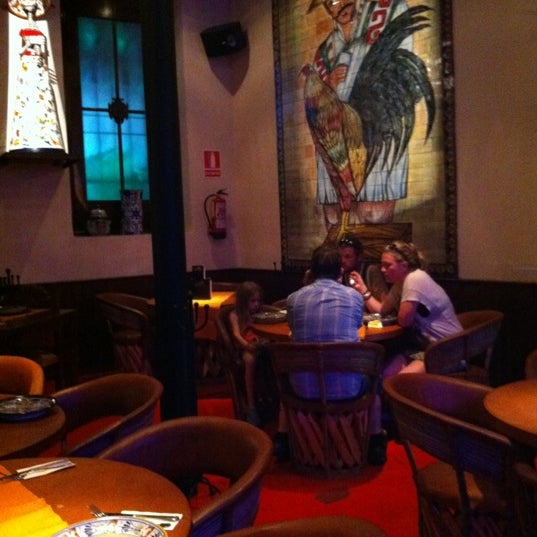 Photo taken at Restaurant &amp; Lounge Los Azulejos by Sarah M. on 7/4/2012