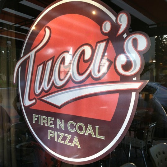 Photo taken at Tucci&#39;s Fire N Coal Pizza by Andrew B. on 4/15/2012