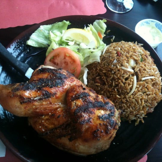 Photo taken at Sabrosura Restaurant by Julio G. on 5/15/2011