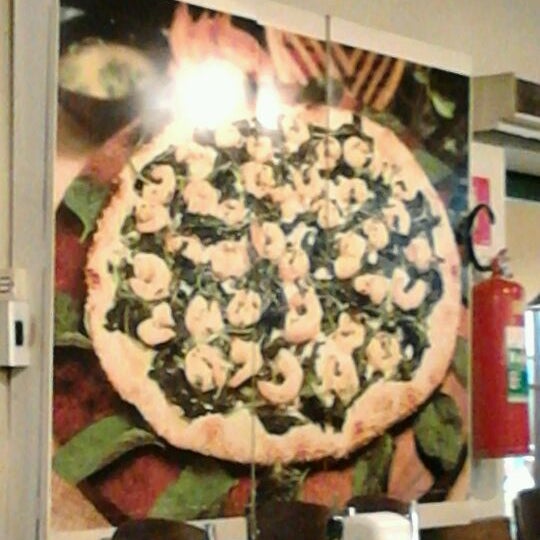 Photo taken at Loppiano Pizza by Tiago C. on 3/11/2012