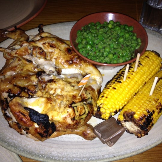 Photo taken at Nando&#39;s by Entheo on 4/21/2012