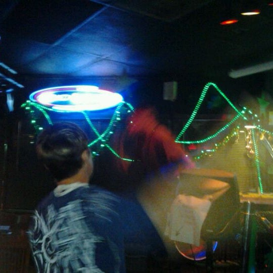 Photo taken at O&#39;Shucks Pub &amp; Karaoke Bar by Jillian S. on 1/14/2012