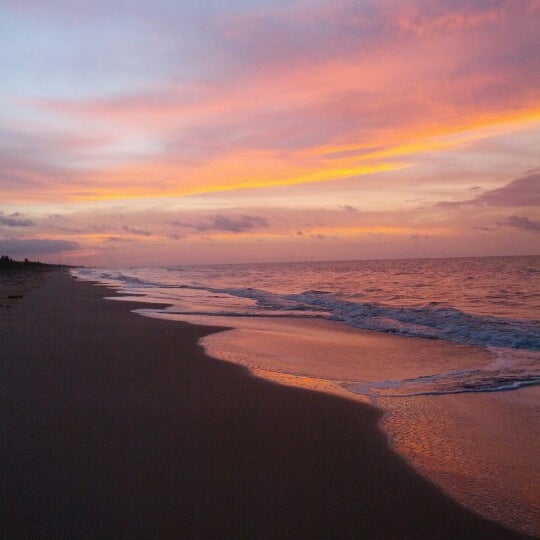 Photo taken at Playa de Boca de Uchire by Zoris V. on 8/19/2012