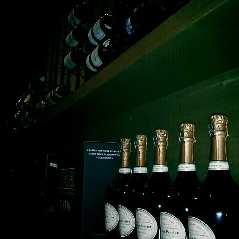 Photo taken at Cork Wine Bar by waterbuffallovee k. on 7/7/2012