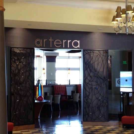 Photo taken at Arterra Restaurant and Lounge by Tyler A. on 8/17/2012