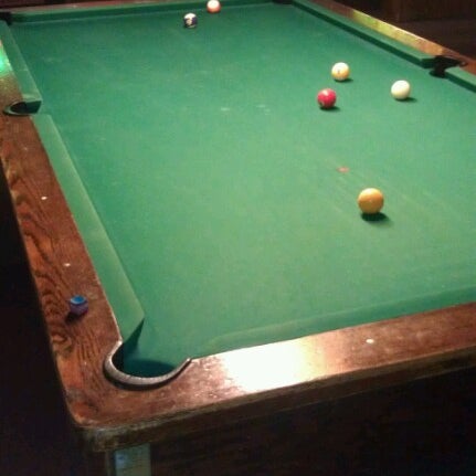 Photo taken at Sharkys Place Sports Bar and Billiards by Nate T. on 7/27/2012