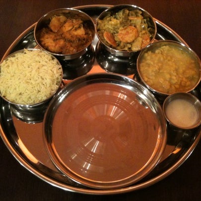 Regular Thali for £7.95 includes rice, vegetable of the day, dhal, yoghurt with your choice of curry